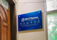 The Ms IT Xpress signboard at the office entrance in New Eskaton, Ramna, Dhaka — web, mobile, desktop software, AI, SEO and security